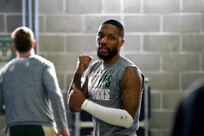Milwaukee Bucks guard Damian Lillard (0) stands outside the locker room before the start of the game against the Golden State Warriors
